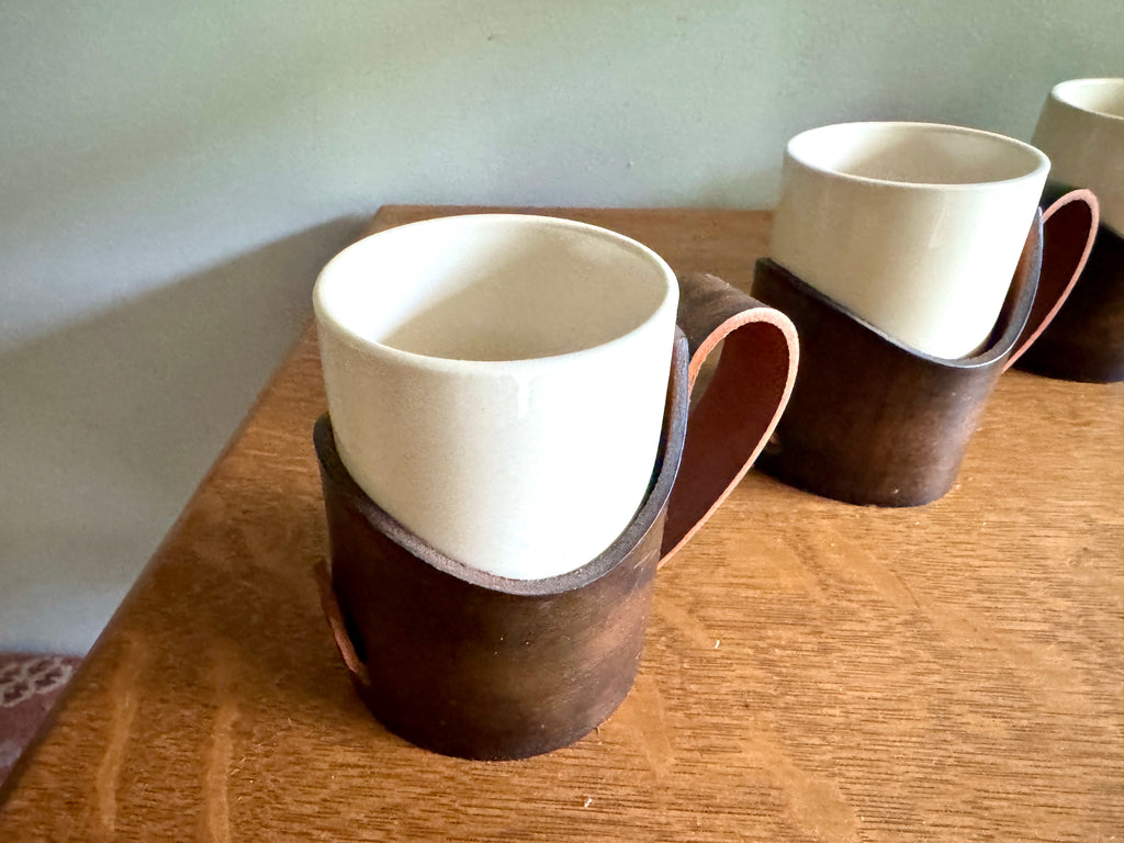 Set of 4 Tooled Leather Mug Holders with Handles and White Ceramic Cups