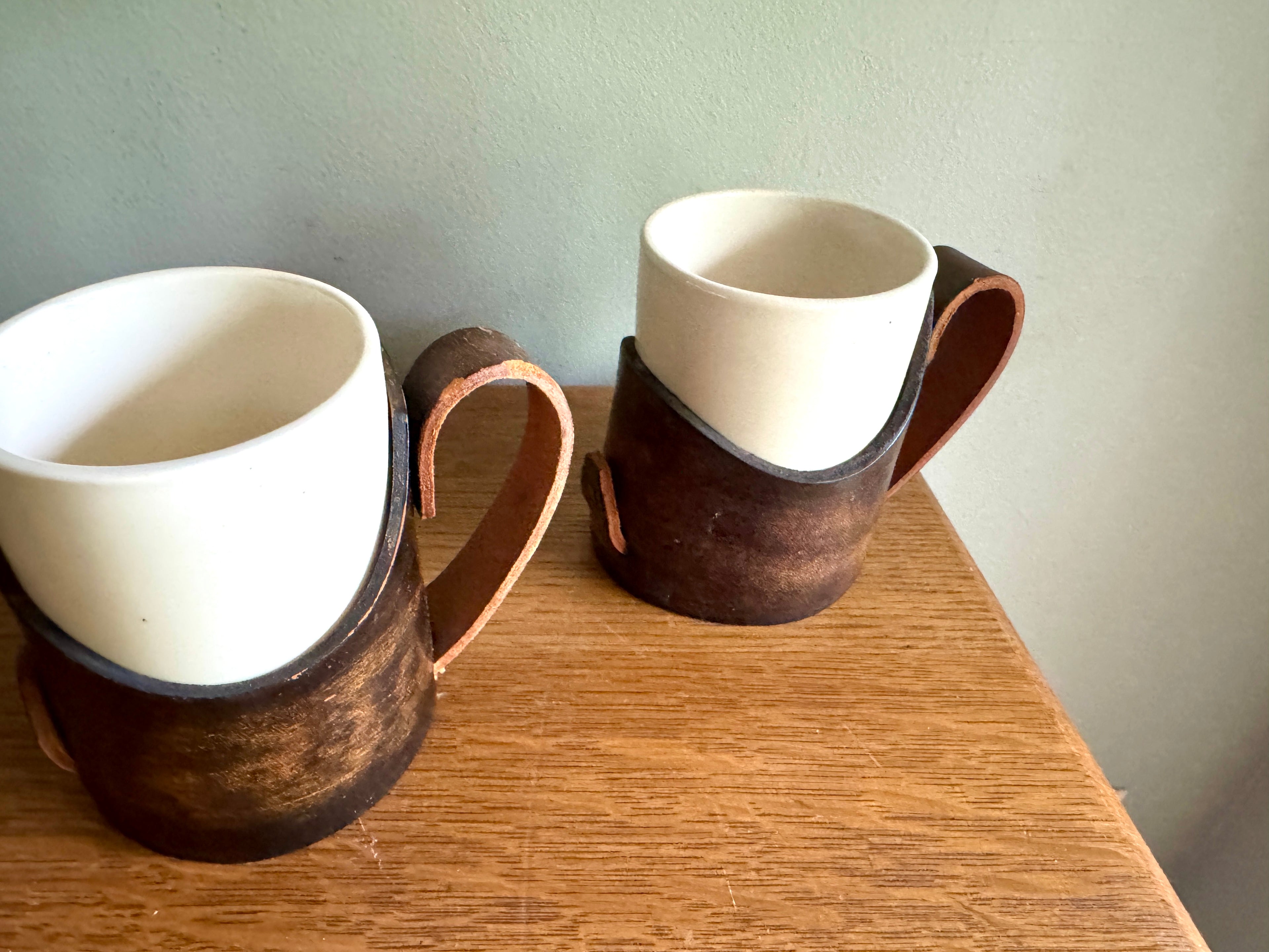 Set of 4 Tooled Leather Mug Holders with Handles and White Ceramic Cups