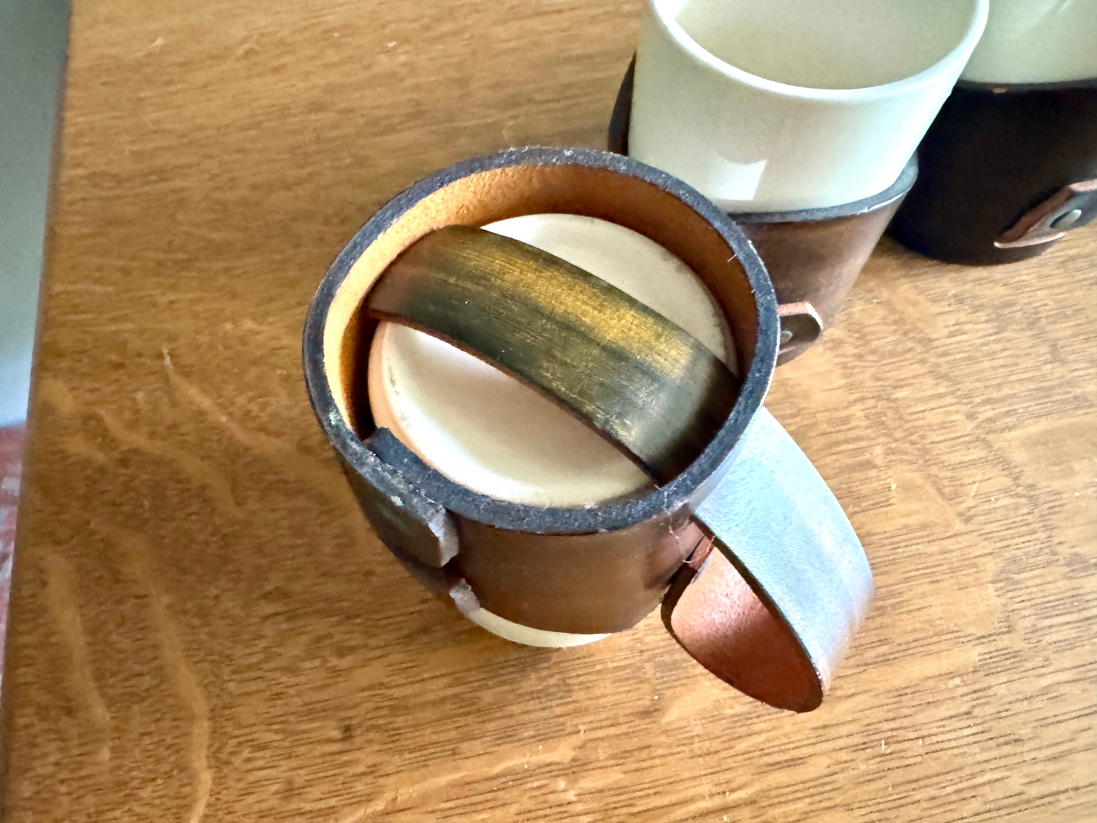 Set of 4 Tooled Leather Mug Holders with Handles and White Ceramic Cups