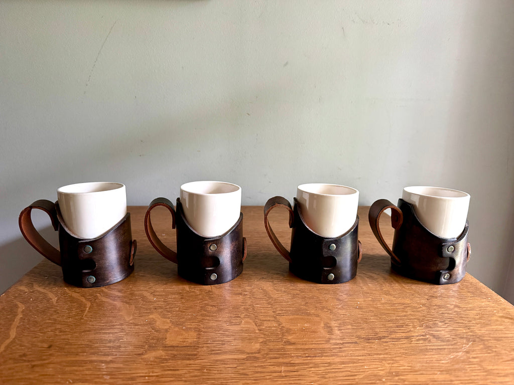Set of 4 Tooled Leather Mug Holders with Handles and White Ceramic Cups