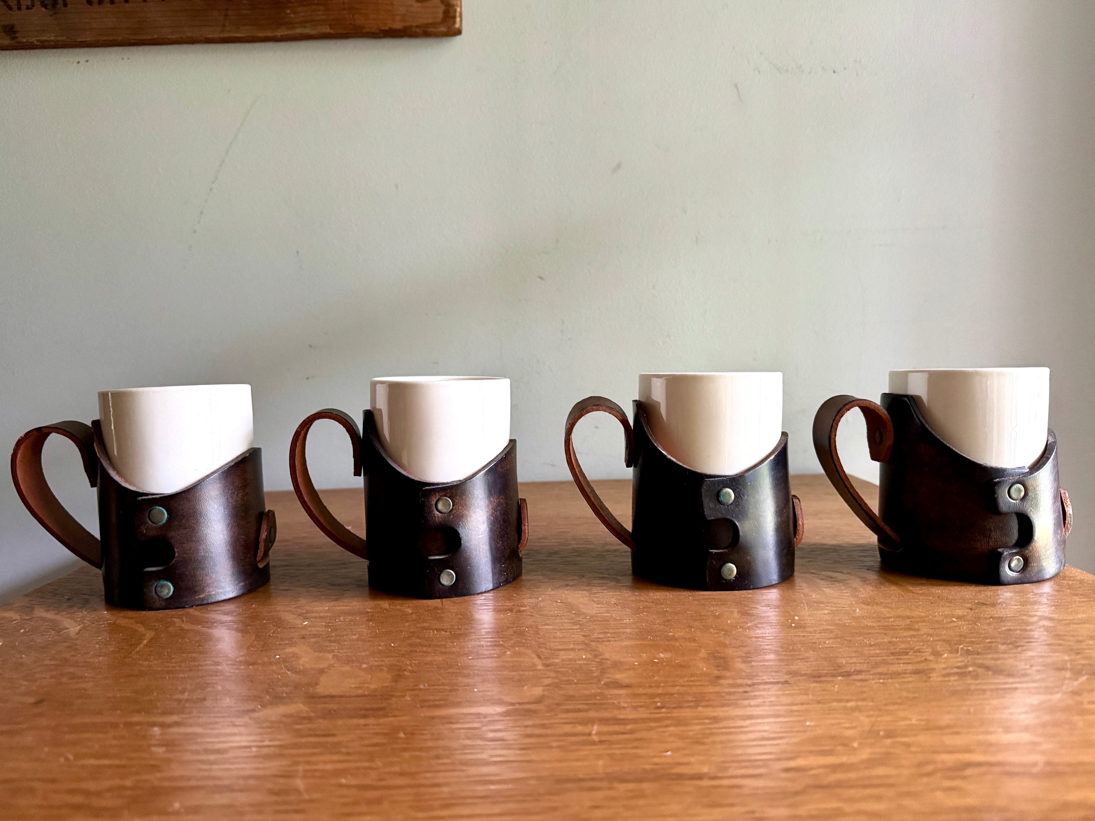 Set of 4 Tooled Leather Mug Holders with Handles and White Ceramic Cups