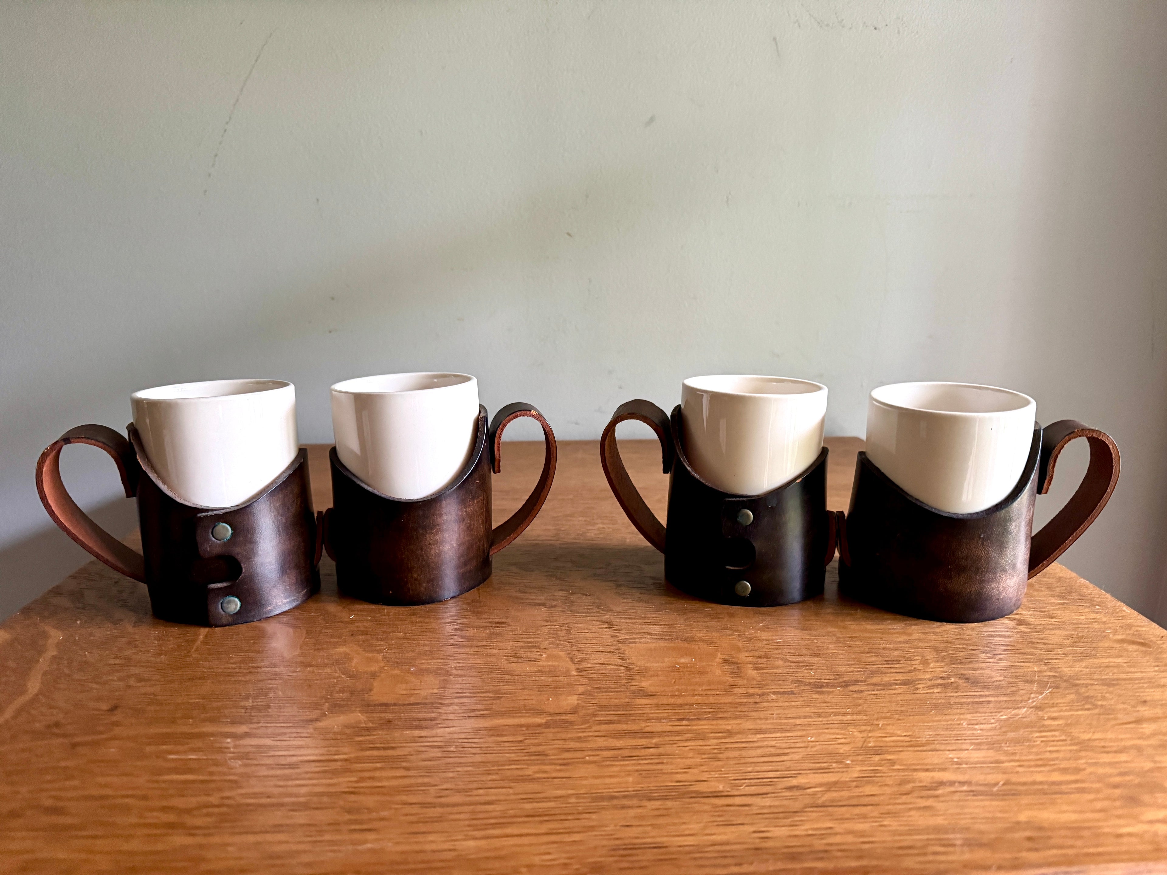 Set of 4 Tooled Leather Mug Holders with Handles and White Ceramic Cups