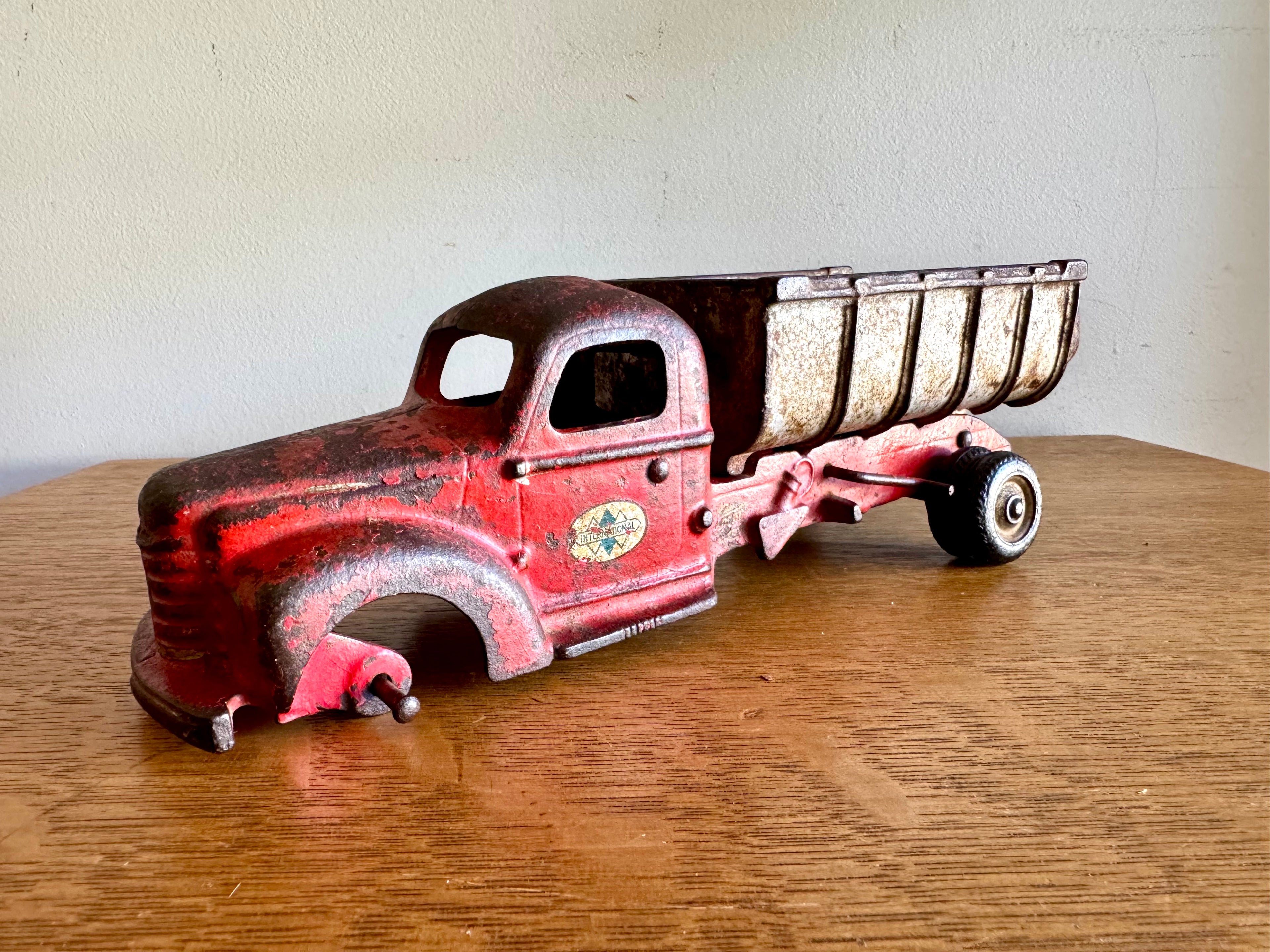 1930's Arcade Cast Iron International Dump Truck | Red Arcade International Cast Iron Truck (No front wheels)