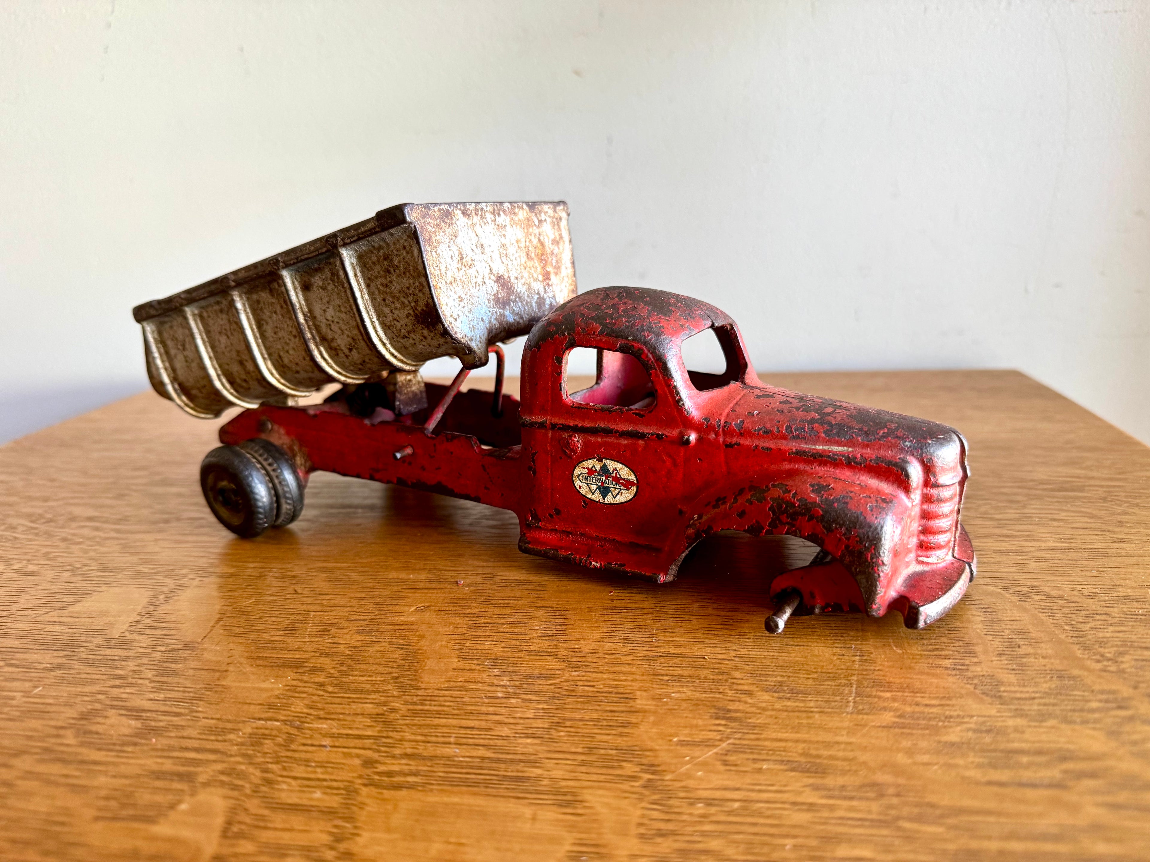 1930's Arcade Cast Iron International Dump Truck | Red Arcade International Cast Iron Truck (No front wheels)