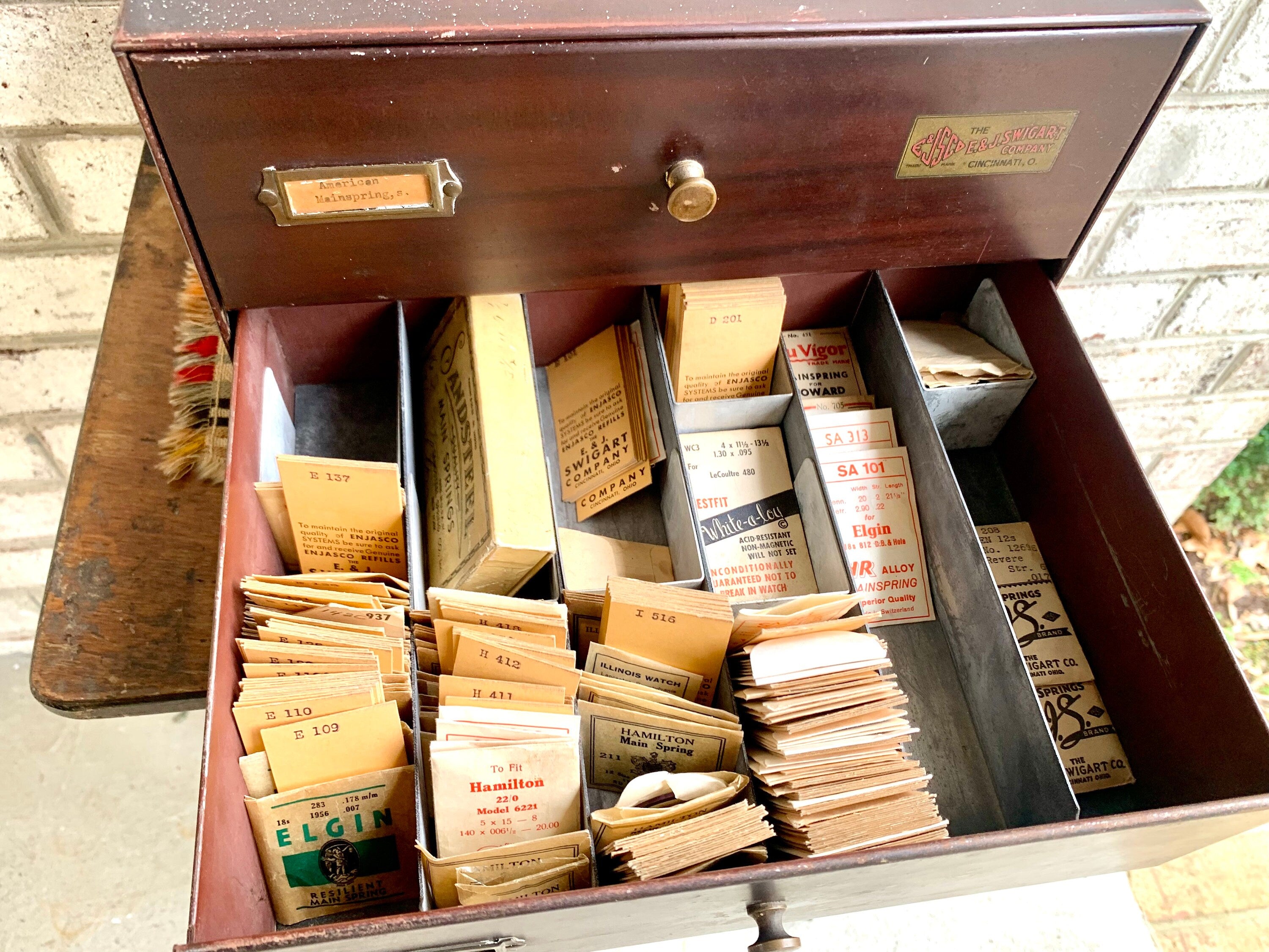 E&J Swigart Co. Cabinet With Contents | Vintage 2 Drawer Swigart Watch Repair Parts and Cabinet | Faux Woodgrain Parts Cabinet | Watch Springs