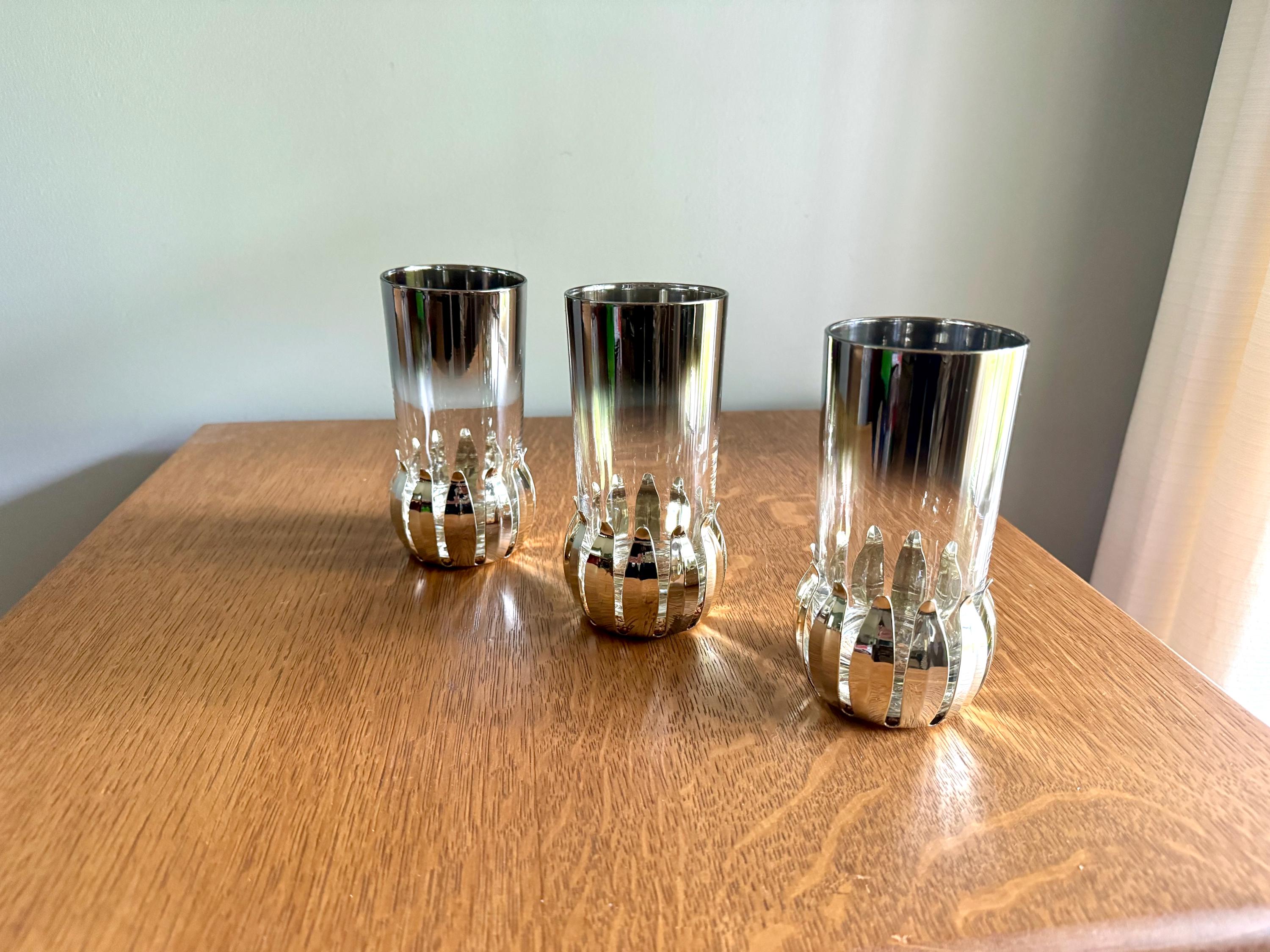 A Set of 3 Lotus Silver Coaster and Silver Rimmed Glasses | 3 Silver Lotus Style Cork Base Coasters and 3 Silver Rimmed Drinking Glasses