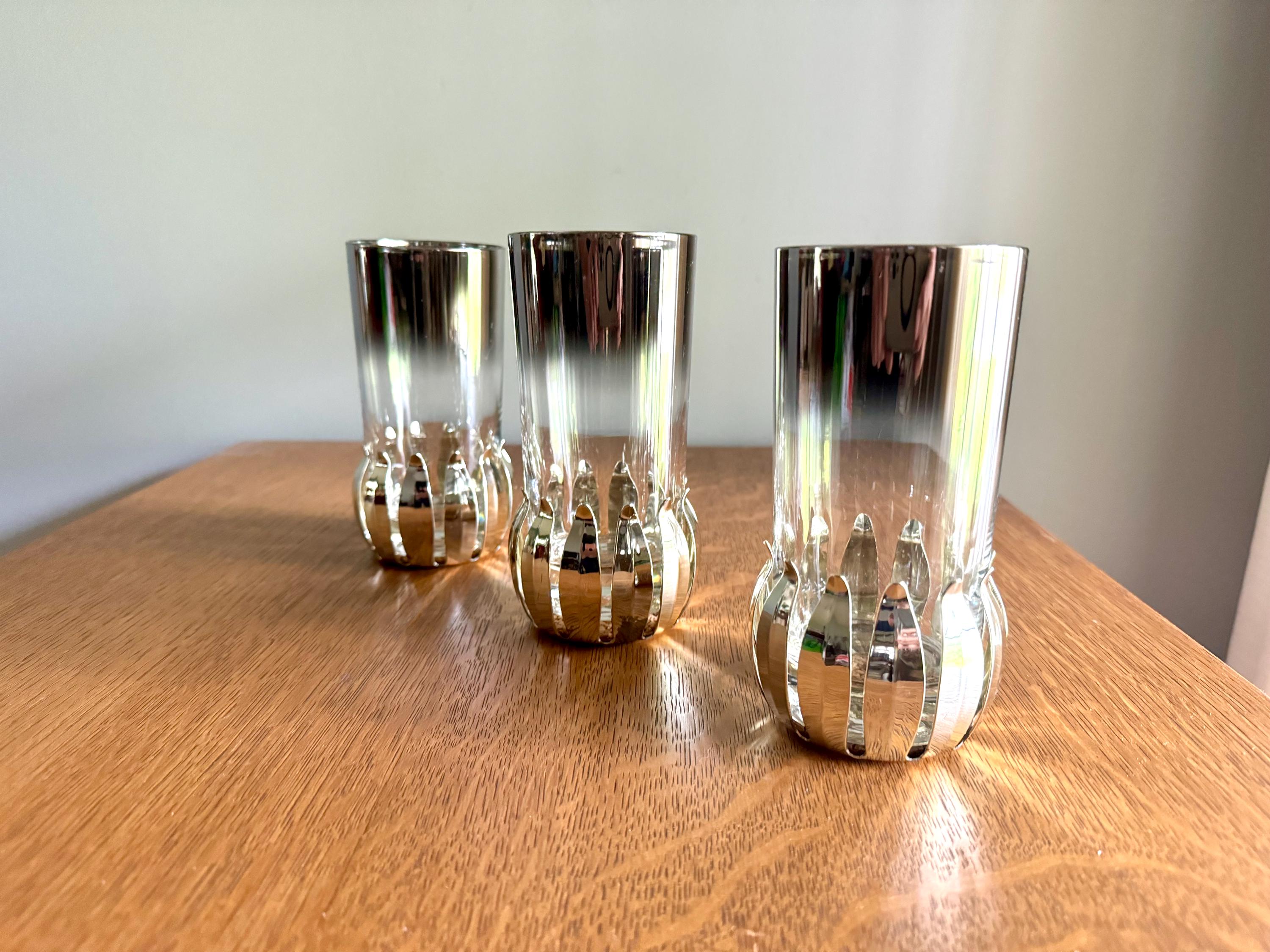 A Set of 3 Lotus Silver Coaster and Silver Rimmed Glasses | 3 Silver Lotus Style Cork Base Coasters and 3 Silver Rimmed Drinking Glasses