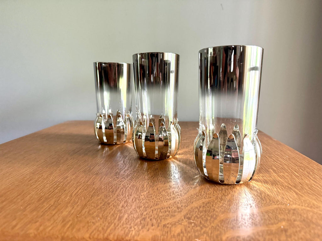 A Set of 3 Lotus Silver Coaster and Silver Rimmed Glasses | 3 Silver Lotus Style Cork Base Coasters and 3 Silver Rimmed Drinking Glasses