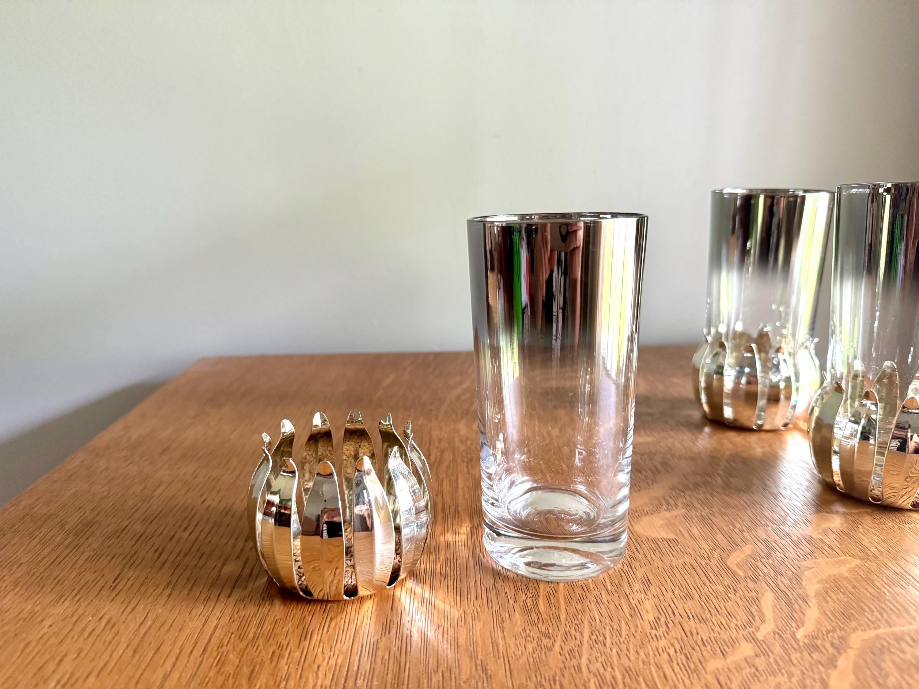 A Set of 3 Lotus Silver Coaster and Silver Rimmed Glasses | 3 Silver Lotus Style Cork Base Coasters and 3 Silver Rimmed Drinking Glasses