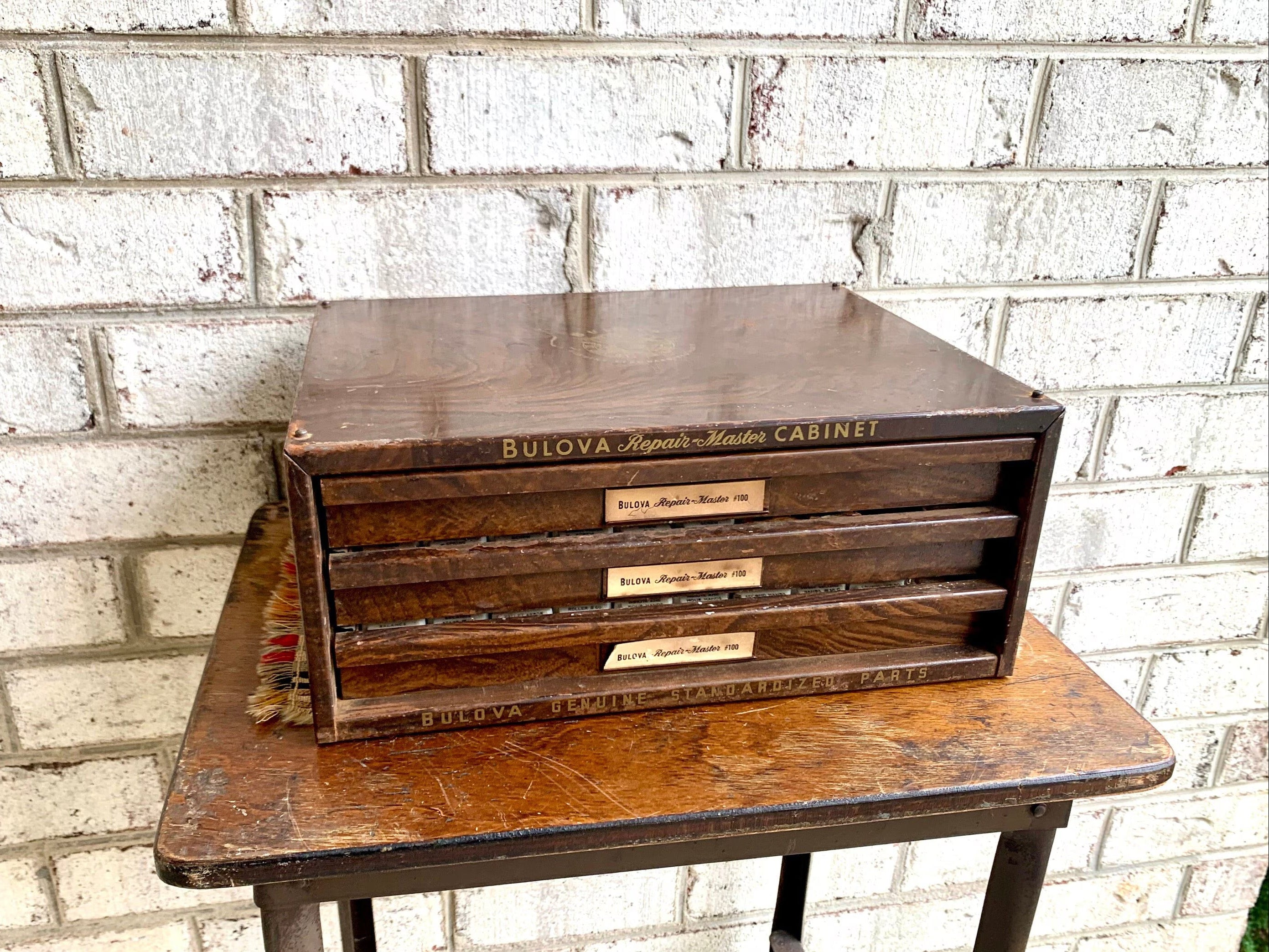 Bulova Repair-Master Cabinet With Contents | Vintage 3 Drawer Bulova Watch Repair Parts and Cabinet | Faux Woodgrain Bulova Parts Cabinet